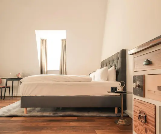 a bedroom with a bed and dresser