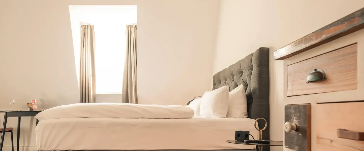 a bedroom with a bed and dresser