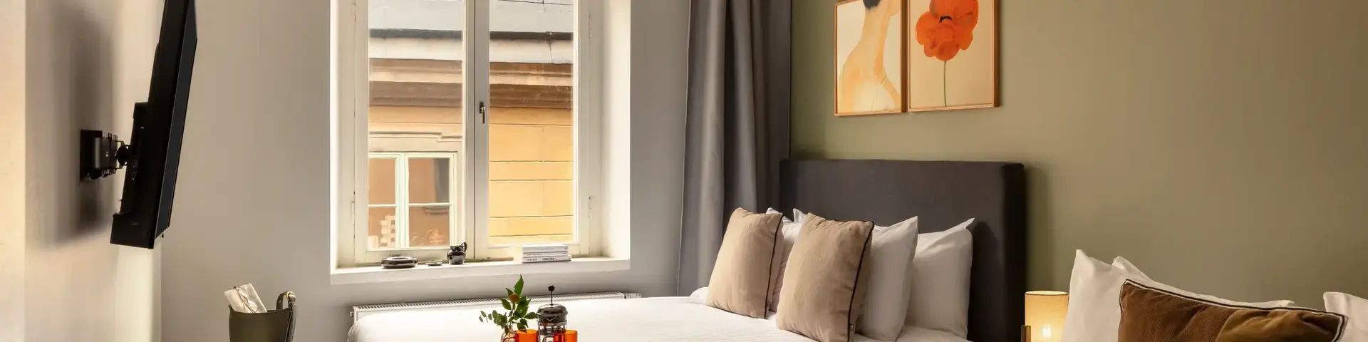 a room with two beds and a window