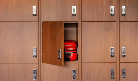 a red luggage in a locker