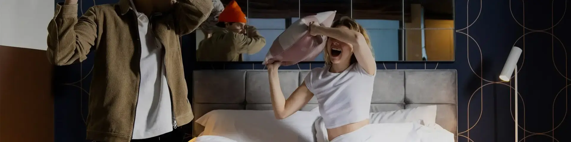 a woman in bed with a pillow in front of her