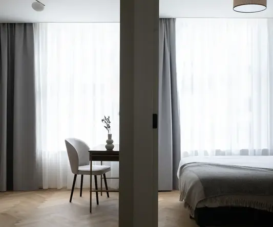 a room with a bed and a chair