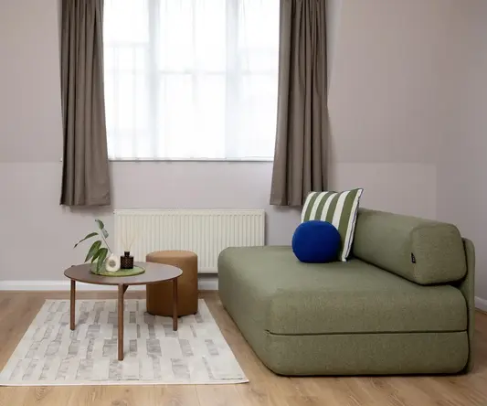 a living room with a couch and a tv