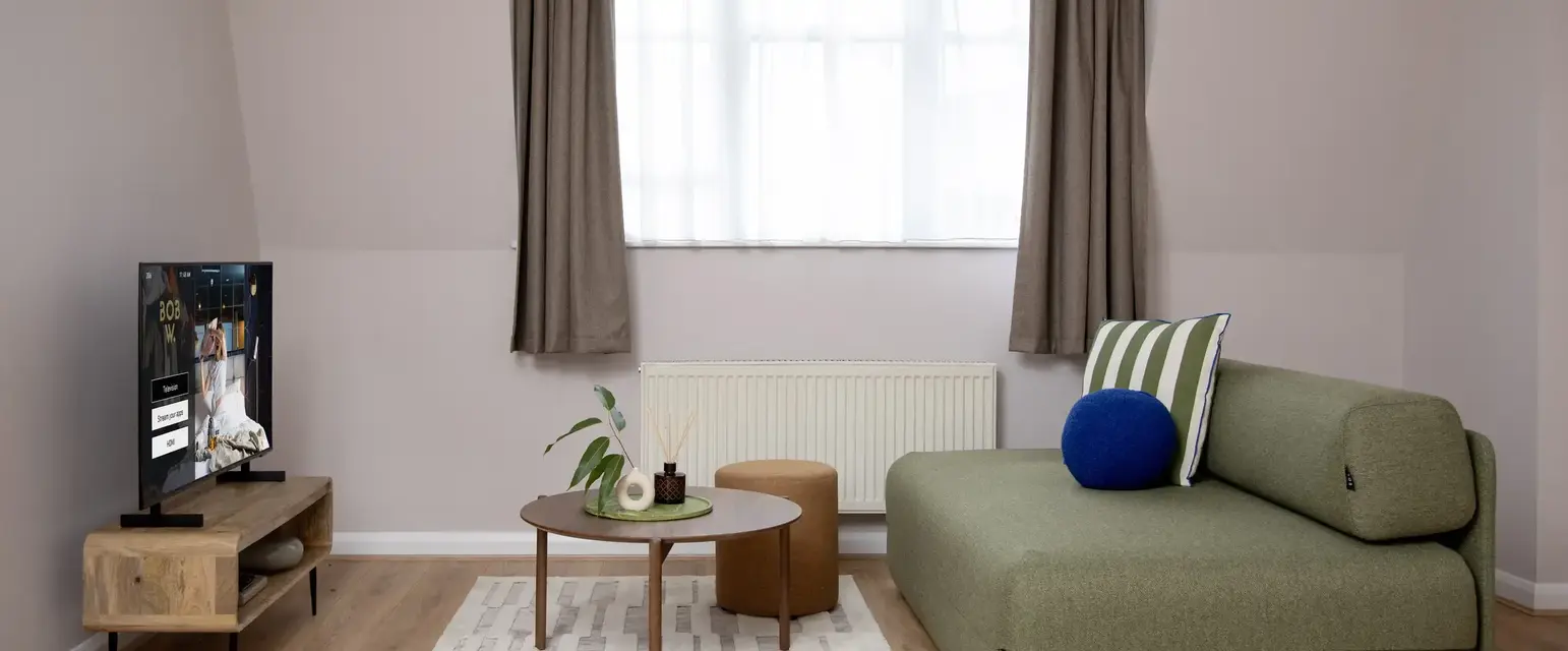 a living room with a couch and a tv