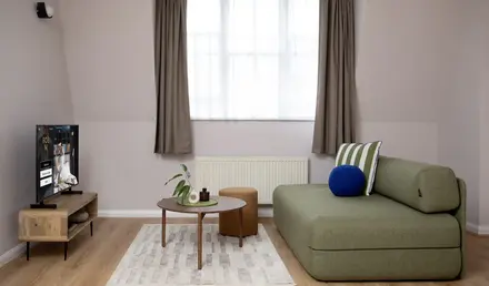 a living room with a couch and a tv