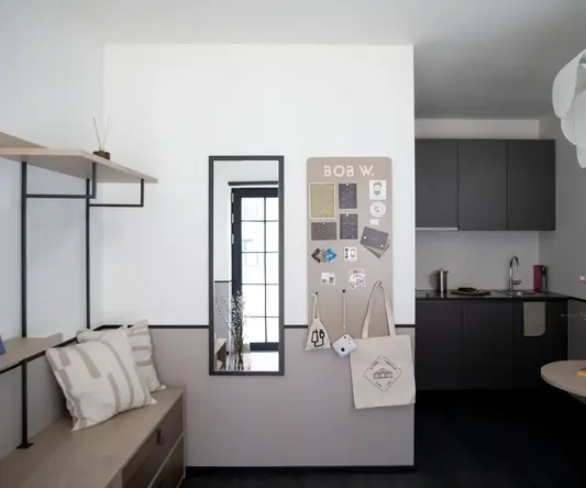 a room with a mirror and a bench