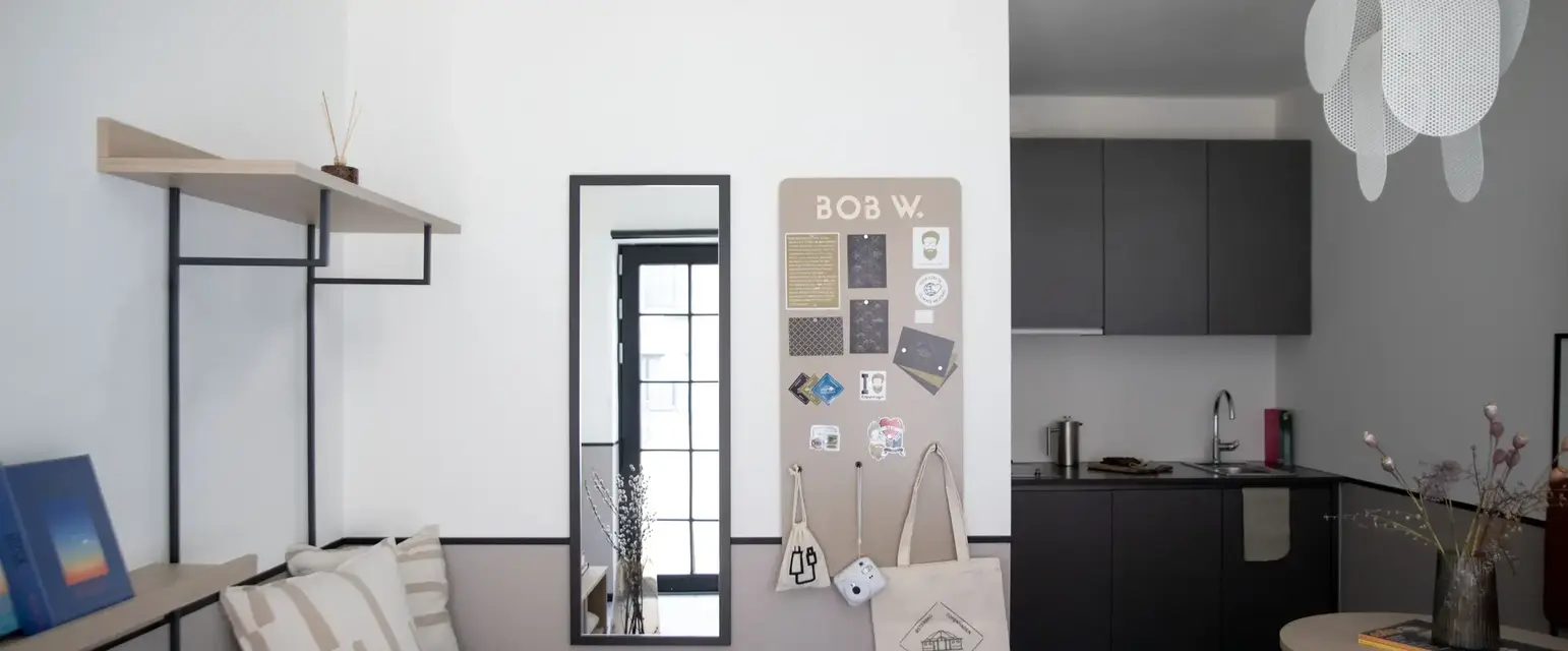 a room with a mirror and a bench