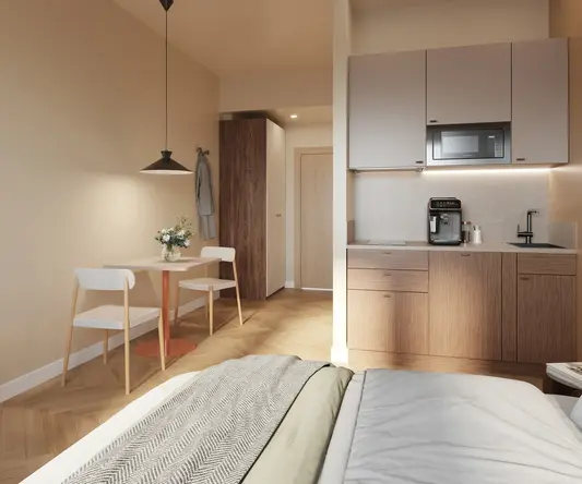 a room with a bed and a table and chairs