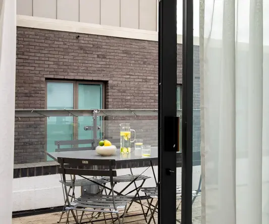 a table and chairs outside a building