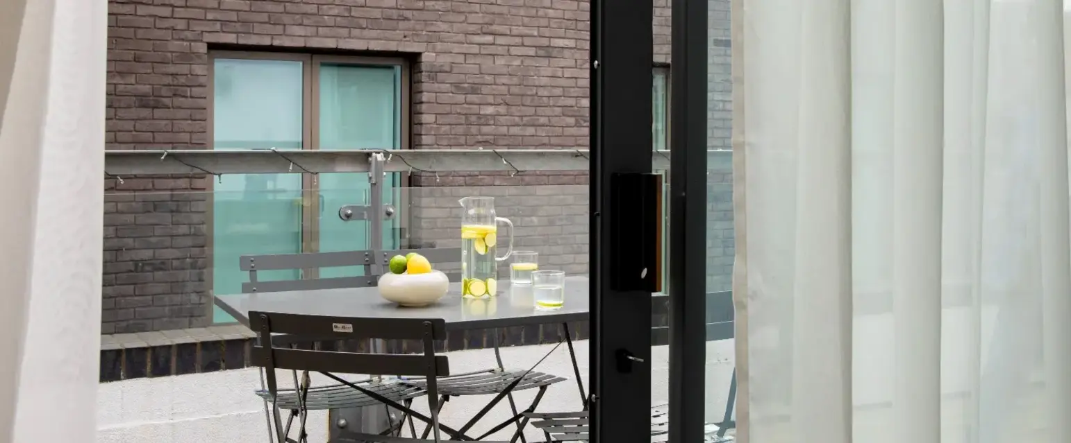 a table and chairs outside a building