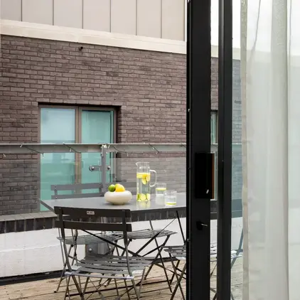 a table and chairs outside a building