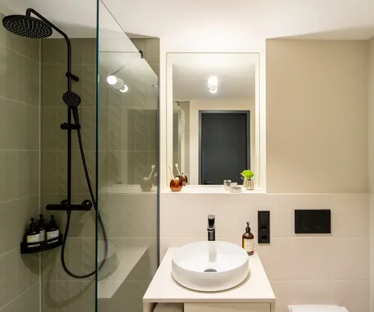 a bathroom with a sink and shower