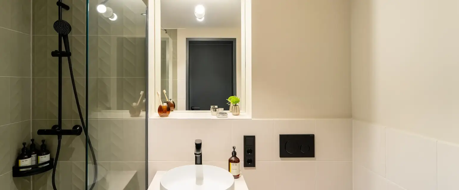 a bathroom with a sink and shower