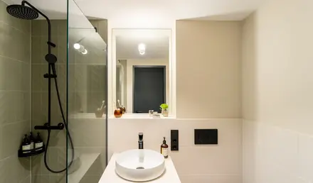 a bathroom with a sink and shower