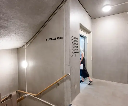 a woman walking in a hallway