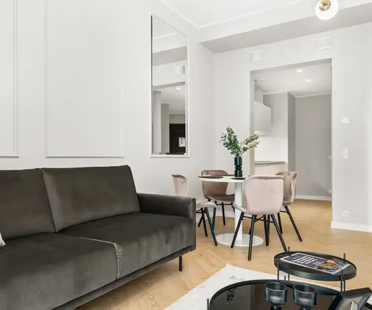 a living room with a couch and a table