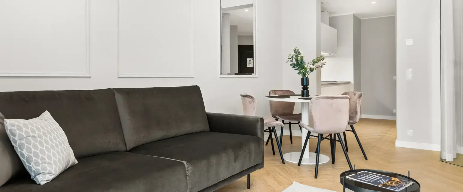 a living room with a couch and a table