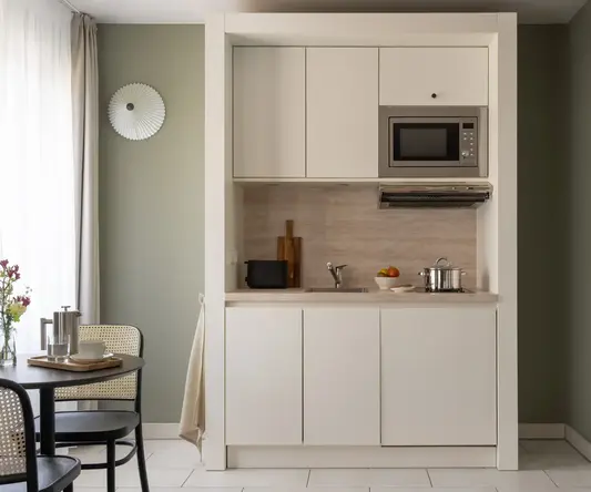 a kitchen with a microwave oven and a table