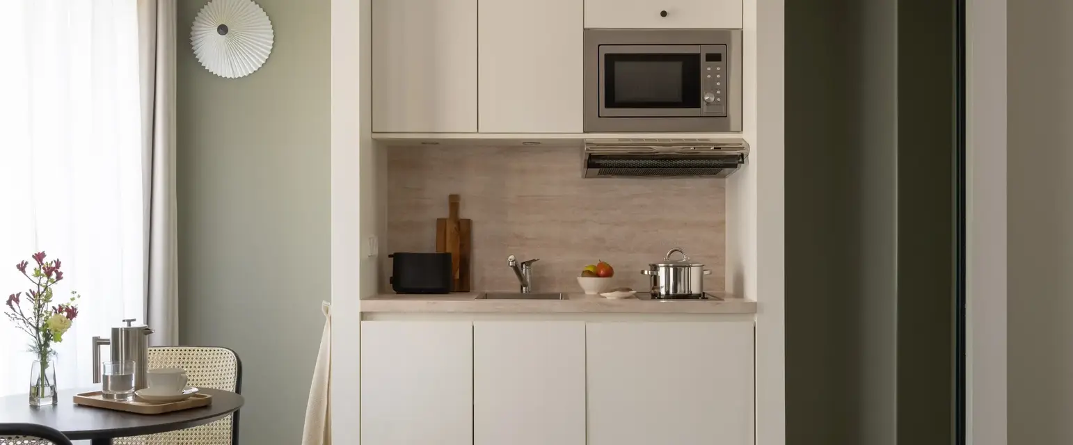 a kitchen with a microwave oven and a table