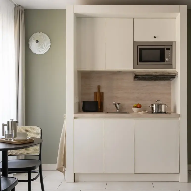 a kitchen with a microwave oven and a table