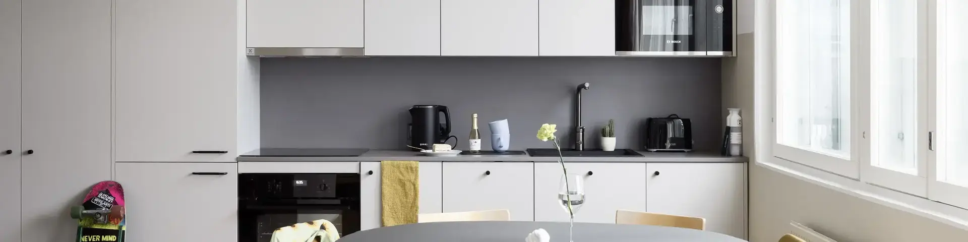 a kitchen with a table and chairs