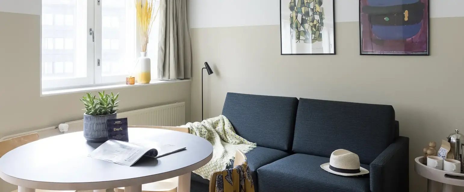 a living room with a couch and a table