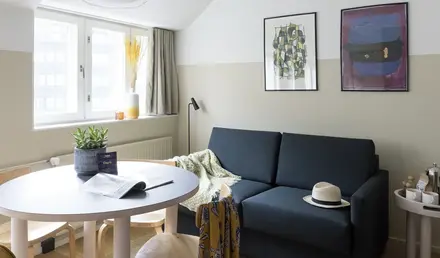 a living room with a couch and a table