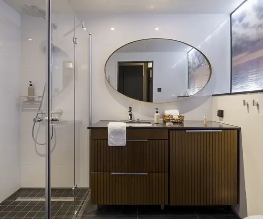 a bathroom with a mirror and a sink