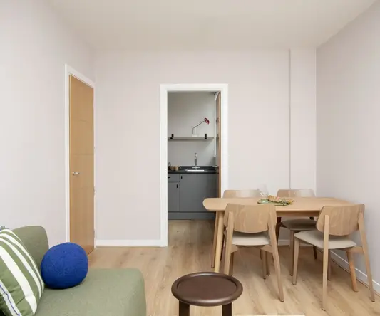 a room with a table and chairs