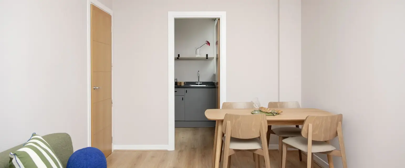 a room with a table and chairs