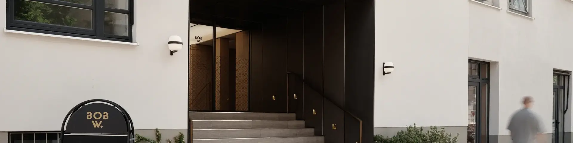 a building with stairs and a sign