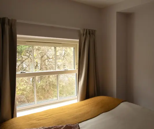 a bed with a window