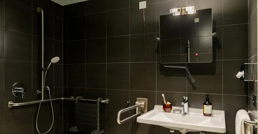 a bathroom with a sink and mirror