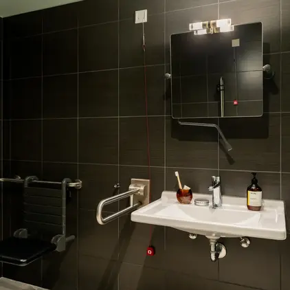 a bathroom with a sink and mirror