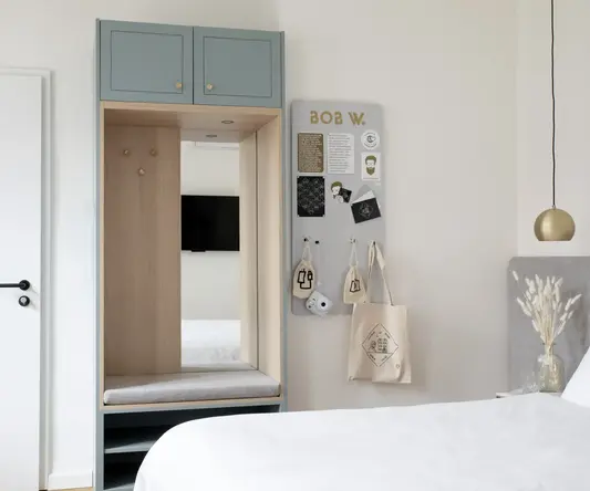 a room with a mirror and a closet