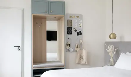 a room with a mirror and a closet
