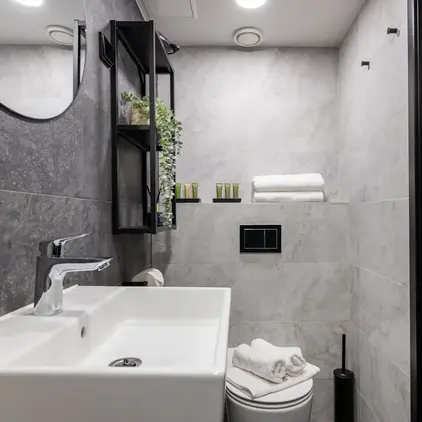 a bathroom with a sink and mirror