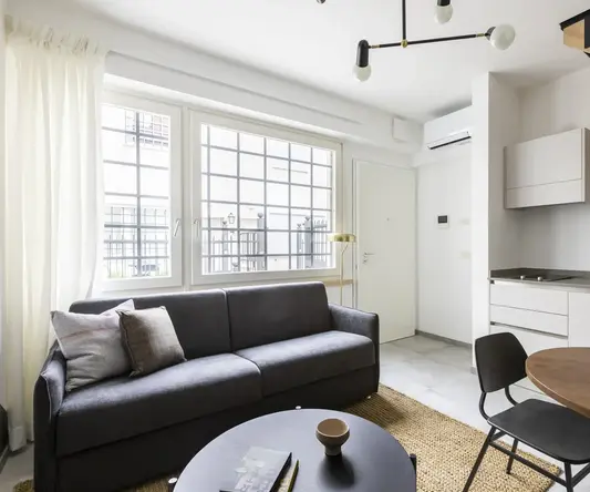 a living room with a couch and a table