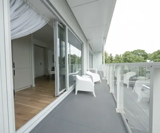 a white chairs on a balcony