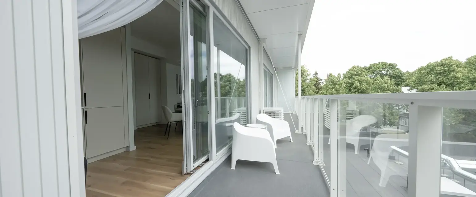 a white chairs on a balcony