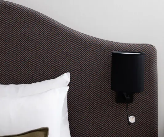 a lamp on a headboard