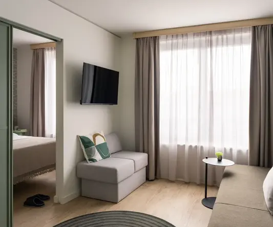 a room with a couch and tv