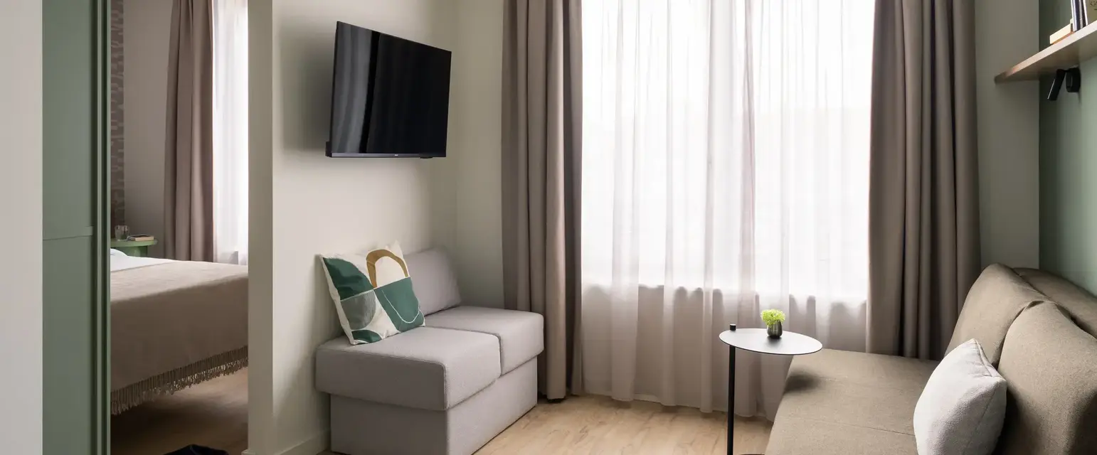 a room with a couch and tv