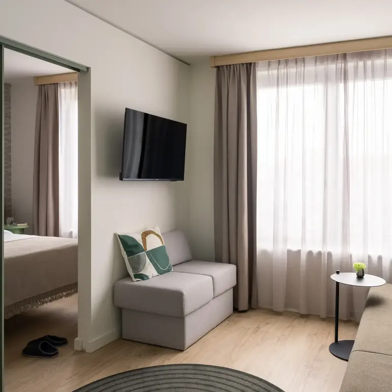 a room with a couch and tv