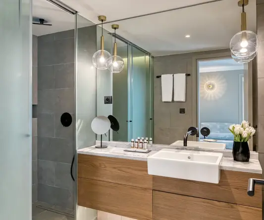 a bathroom with a sink and shower