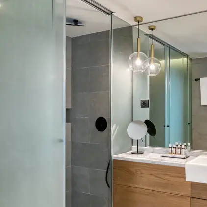 a bathroom with a sink and shower