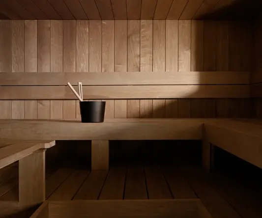 a wooden bench with a cup of chopsticks in it