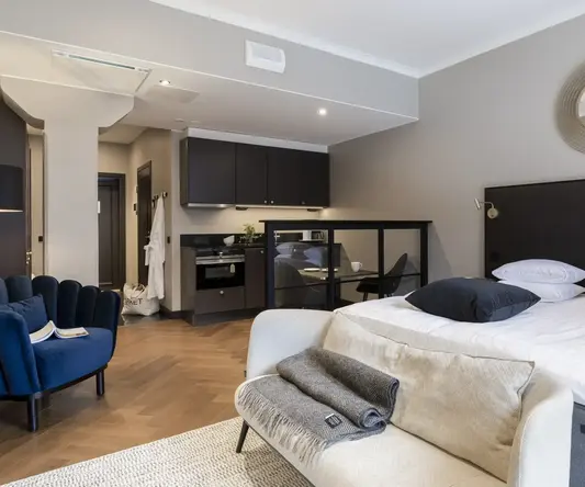 a bedroom with a bed and a chair