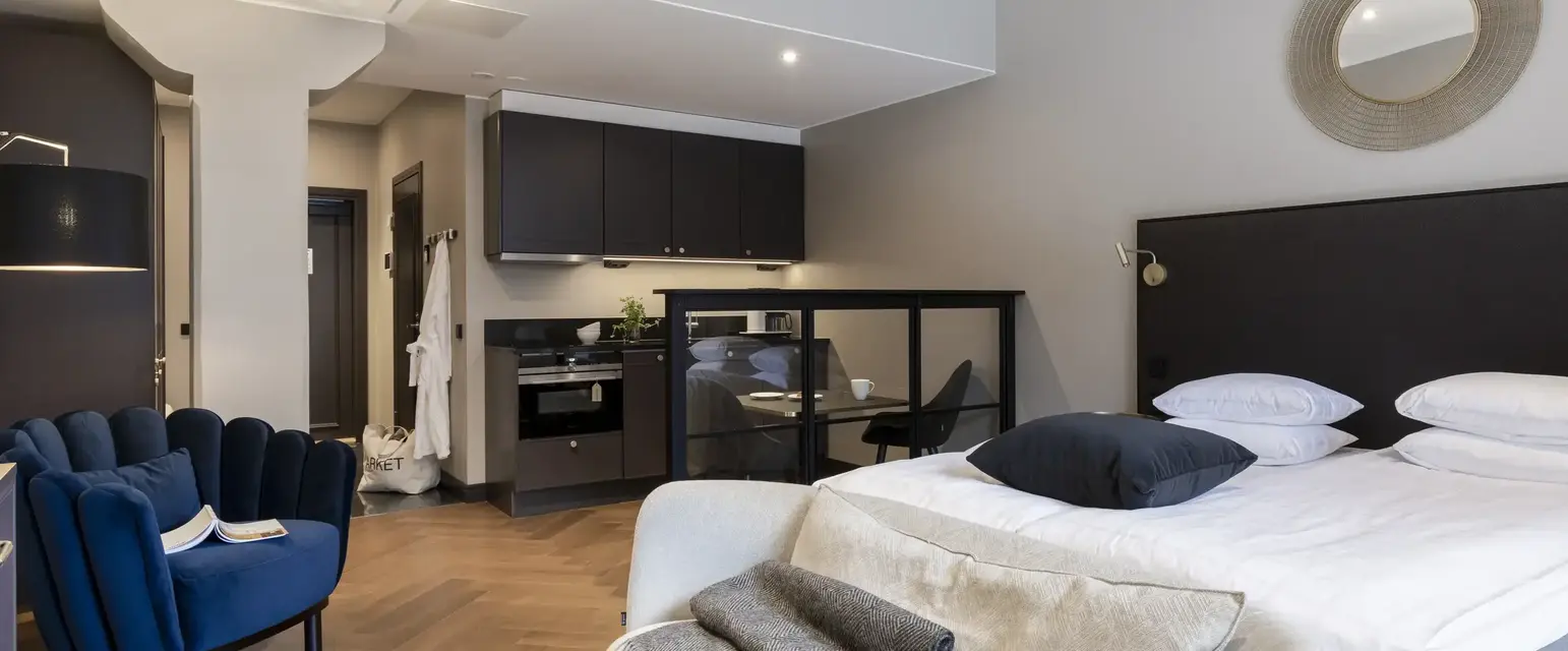 a bedroom with a bed and a chair