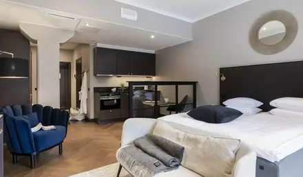 a bedroom with a bed and a chair